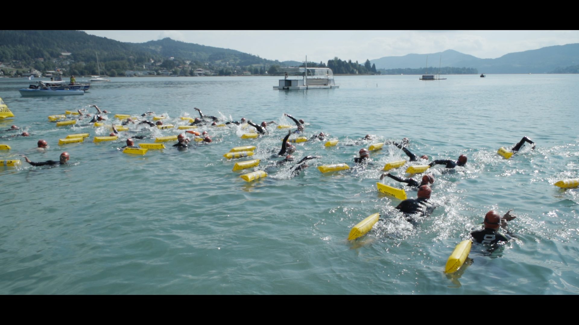 A group of people swimming in the water at Austria Swim Open.