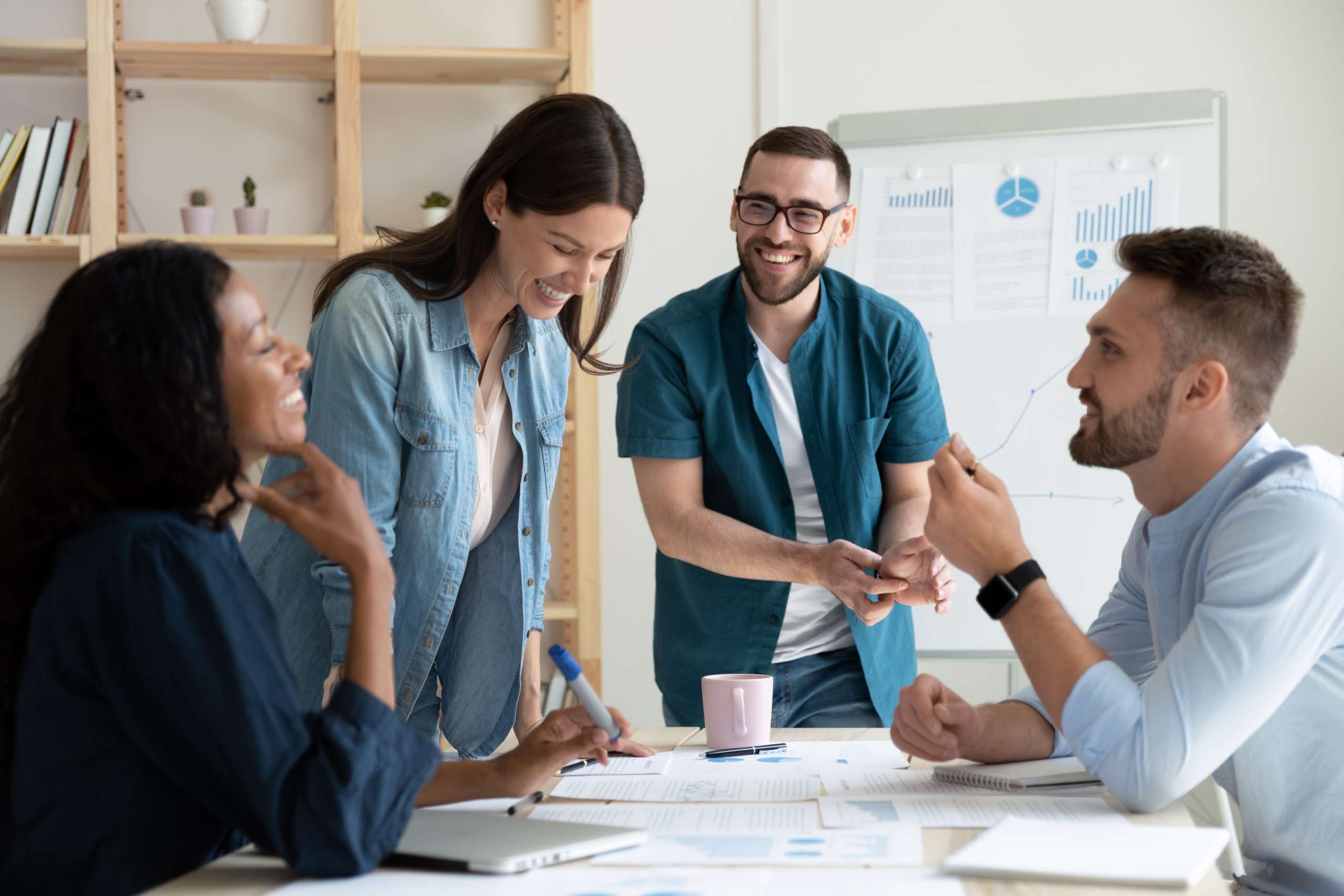 A group of people discussing career opportunities in an office.