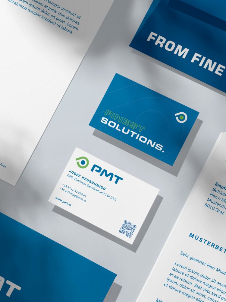 A business card, letterhead and business cards for PMT.