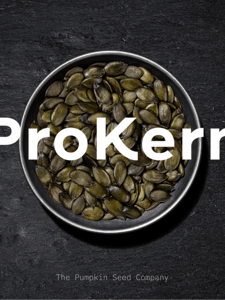 A bowl of pumpkin seeds with the word 'ProKern' on it.